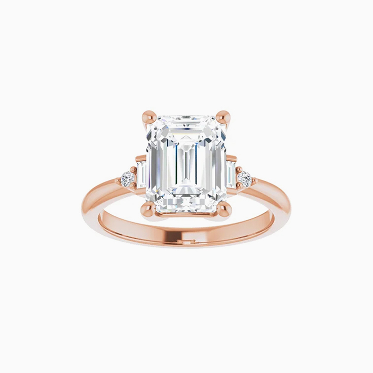 Emerald trilogy engagement ring