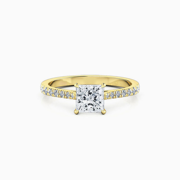 Princess cut diamond in four claw set engagement ring