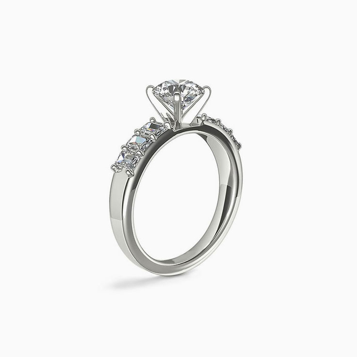 Brilliant Round And Emerald Cut Diamond Engagement Ring