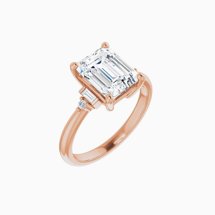 Emerald trilogy engagement ring
