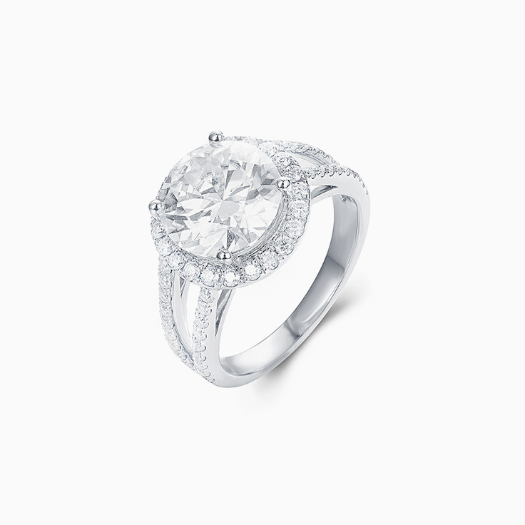 Round Brilliant cut with a diamond halo on a split band Enagement ring
