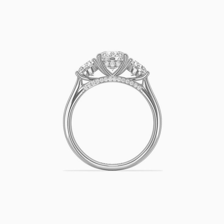 Round brilliant cut diamonds in a trilogy setting engagemnt ring